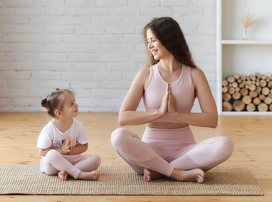 Mom and child meditating