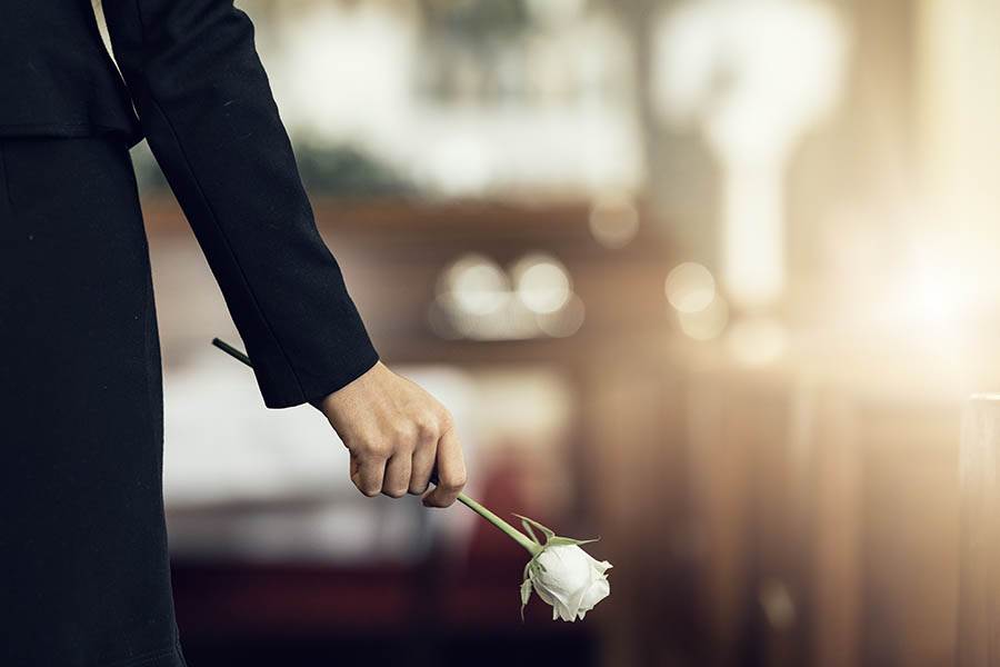 Widow holding a rose